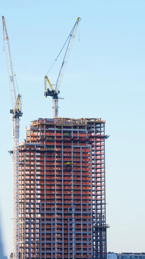 Tower cranes over a building under construction